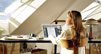 Girl looking out of loft conversion window